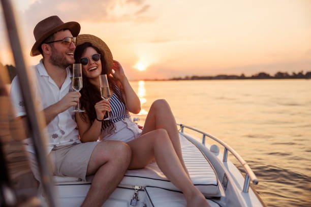 Happy family on a boat, sunset, lifestyle shot